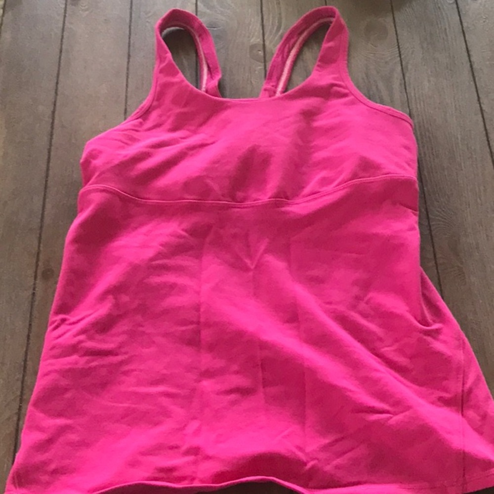Lululemon size 8 top with built in bra support. Mesh on the back.